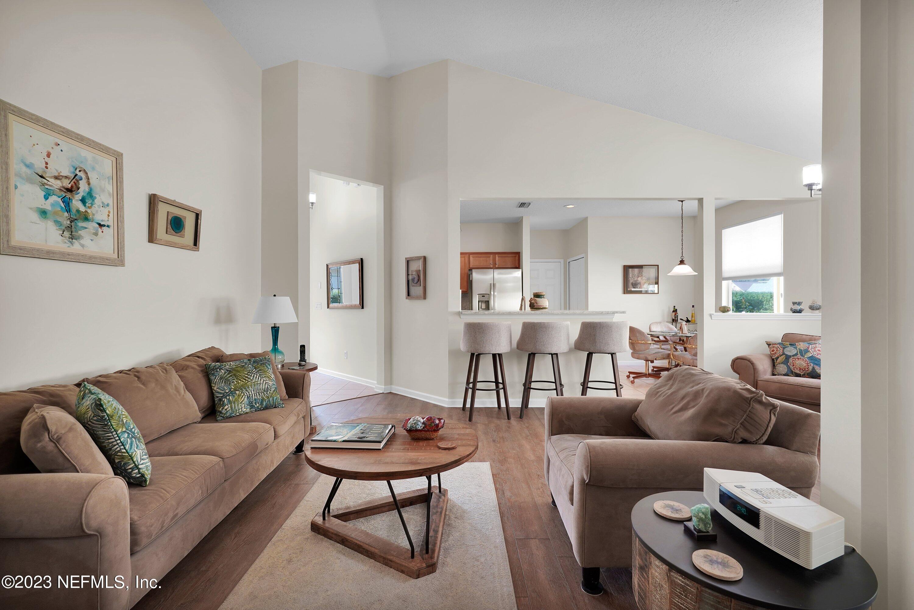 746 Copperhead Circle St. Augustine, FL 32092 - Photo 9 of 40 a living room with furniture wooden floor and a couch