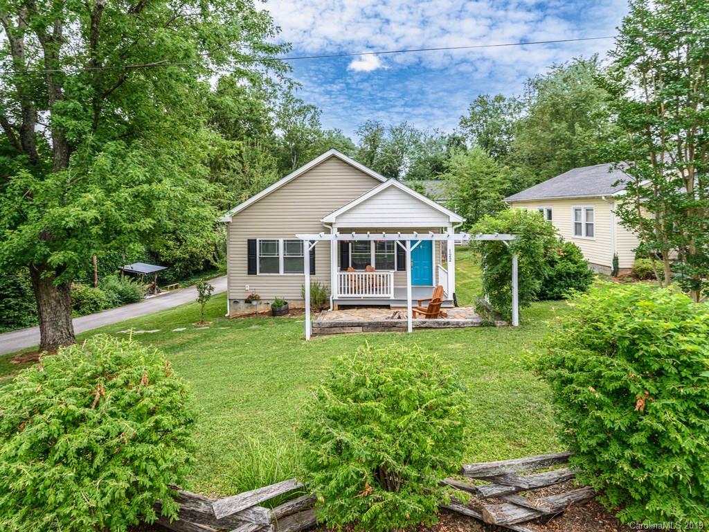122 Round Top Road Asheville, NC 28803 - Photo 1 of 32 a house view with a garden space