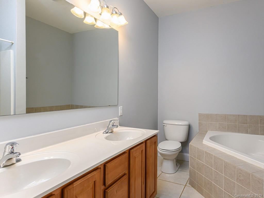 122 Round Top Road Asheville, NC 28803 - Photo 17 of 32 a bathroom with a sink a toilet and a bathtub