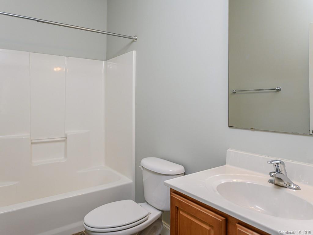 122 Round Top Road Asheville, NC 28803 - Photo 20 of 32 a bathroom with a sink toilet and shower