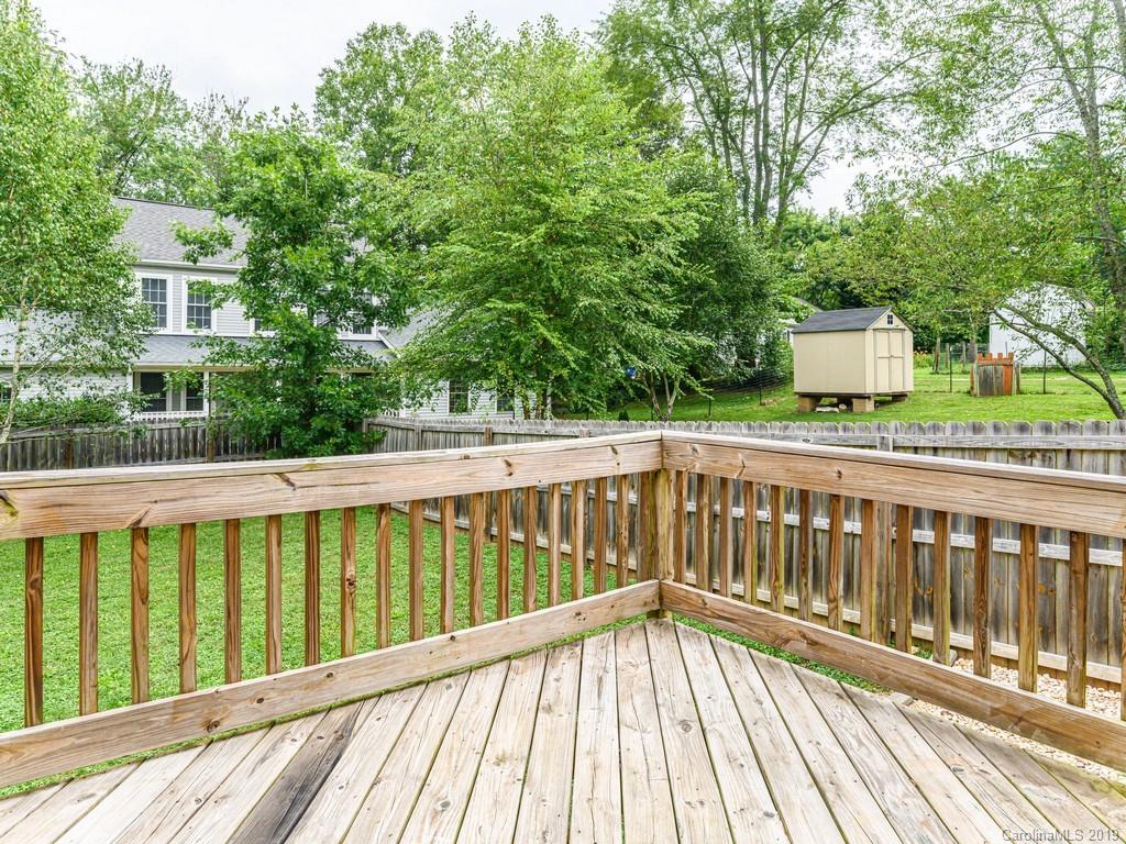 122 Round Top Road Asheville, NC 28803 - Photo 22 of 32 a view of balcony with wooden floor and fence