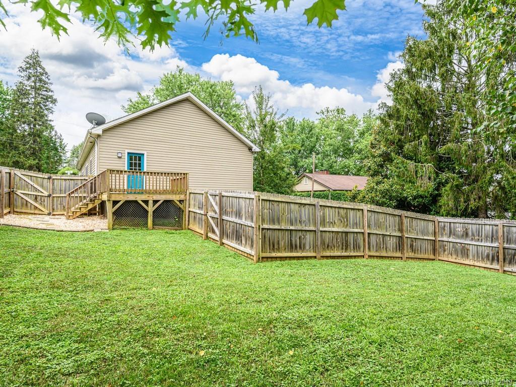122 Round Top Road Asheville, NC 28803 - Photo 25 of 32 a view of a house with a yard and sitting area