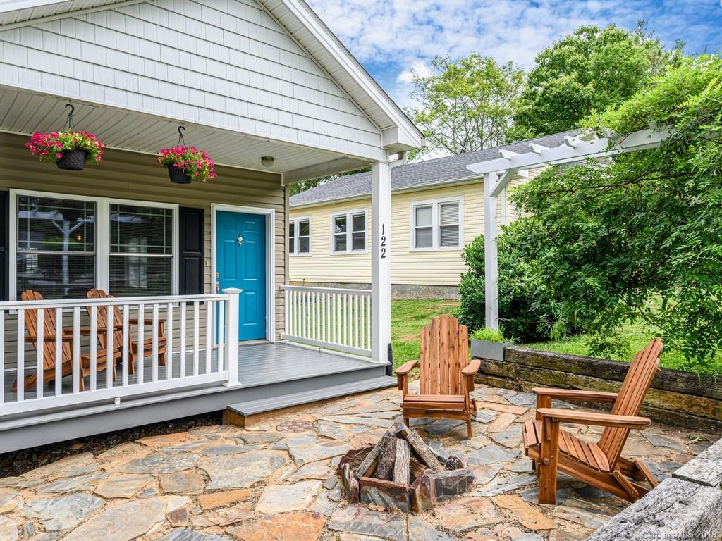 122 Round Top Road Asheville, NC 28803 - Photo 4 of 32 a view of a patio with table and chairs and potted plants