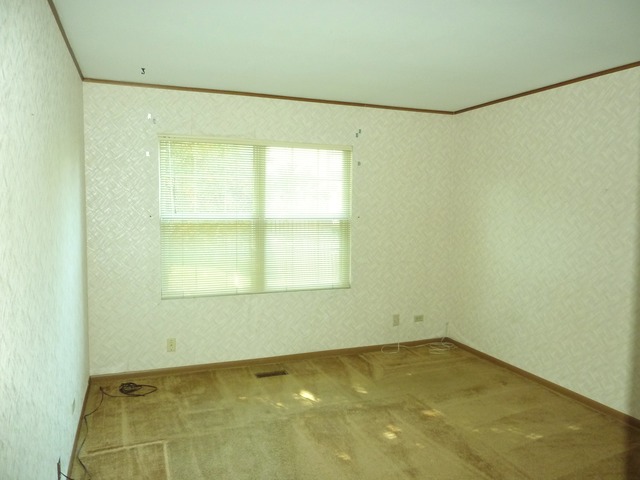 1820 77th Street Naperville, IL 60565 - Photo 13 of 18 a view of a room with a window and a garage