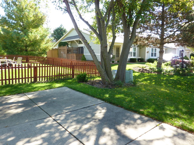 1820 77th Street Naperville, IL 60565 - Photo 16 of 18 a front view of a house with garden