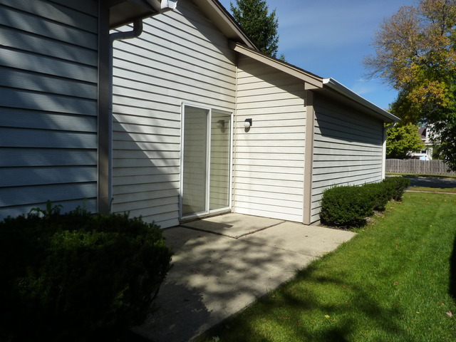 1820 77th Street Naperville, IL 60565 - Photo 18 of 18 a view of a white house with a small yard