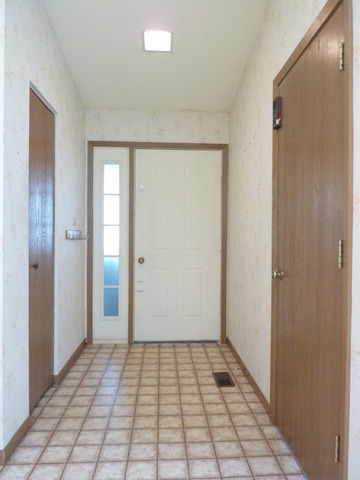 1820 77th Street Naperville, IL 60565 - Photo 10 of 18 a view of a room with a door and wooden floor