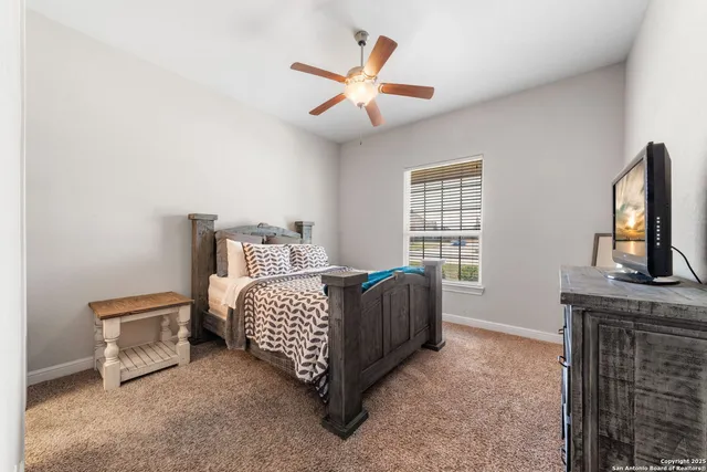 a bed room with a bed and a window