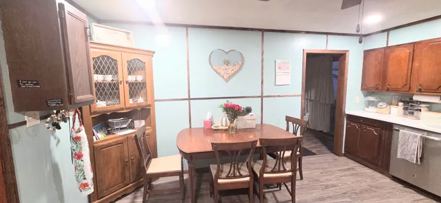 a view of a dining room with furniture window and wooden floor