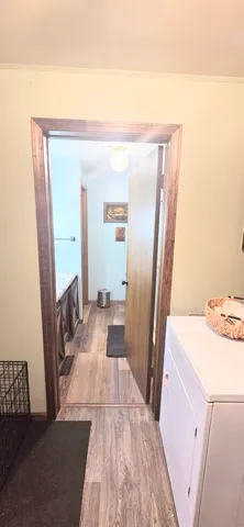 a view of a bedroom from a hallway