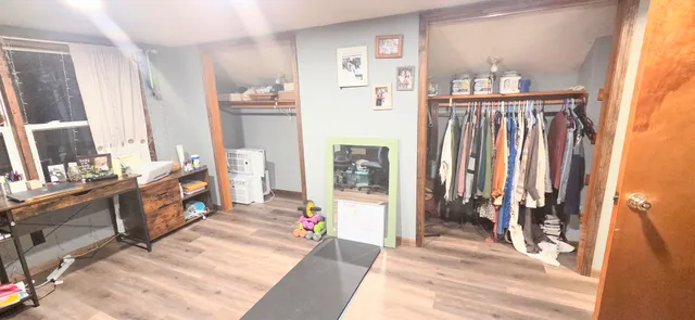 a spacious bathroom with a double vanity sink and a mirror