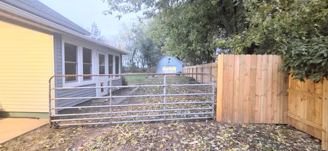 a view of entryway with wooden floor and a yard