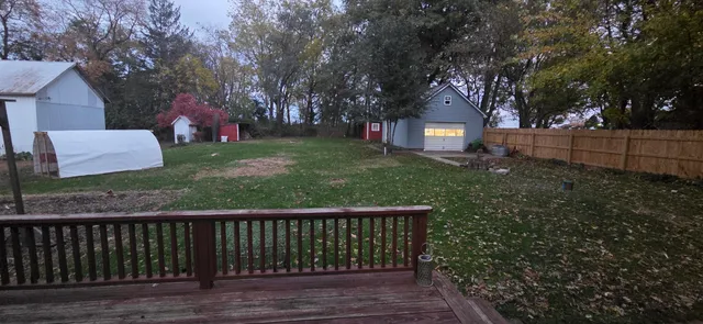 a view of a deck with a yard