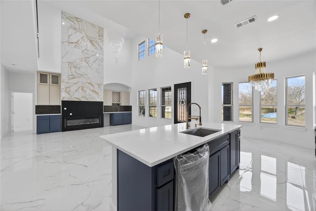 1530 South Houston School Road Lancaster, TX 75146 - Photo 13 of 37 a kitchen with granite countertop a sink and cabinets