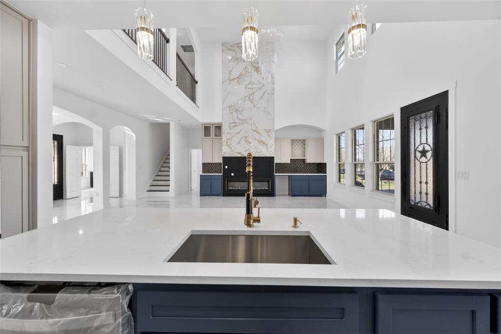 1530 South Houston School Road Lancaster, TX 75146 - Photo 15 of 37 a view of a kitchen with kitchen island a sink stainless steel appliances and cabinets
