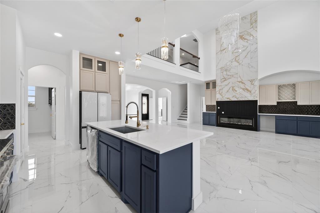 1530 South Houston School Road Lancaster, TX 75146 - Photo 16 of 37 a large kitchen with kitchen island a sink stainless steel appliances and cabinets
