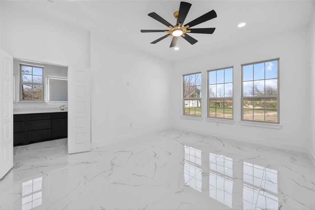 1530 South Houston School Road Lancaster, TX 75146 - Photo 19 of 37 an empty room with windows and cabinet