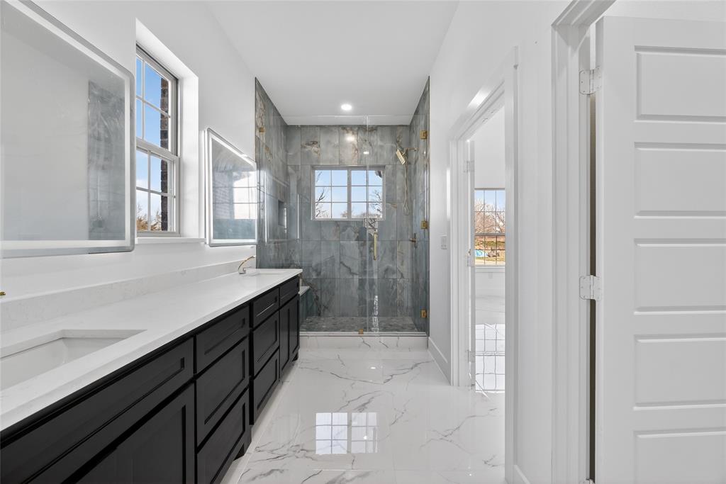 1530 South Houston School Road Lancaster, TX 75146 - Photo 20 of 37 a bathroom with a granite countertop sink mirror and shower