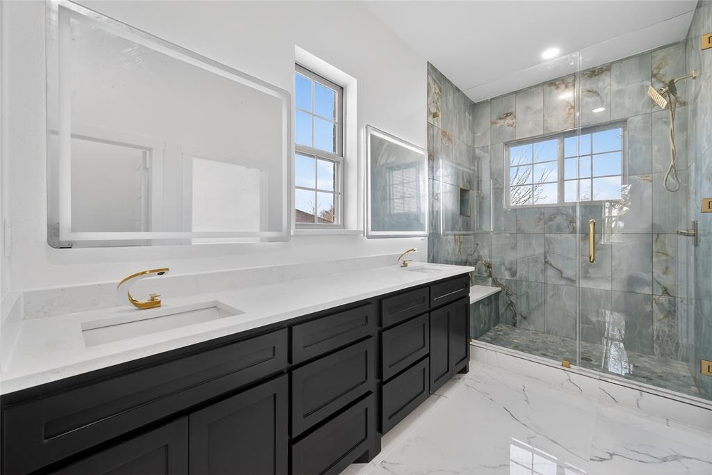1530 South Houston School Road Lancaster, TX 75146 - Photo 23 of 37 a bathroom with a sink and a mirror