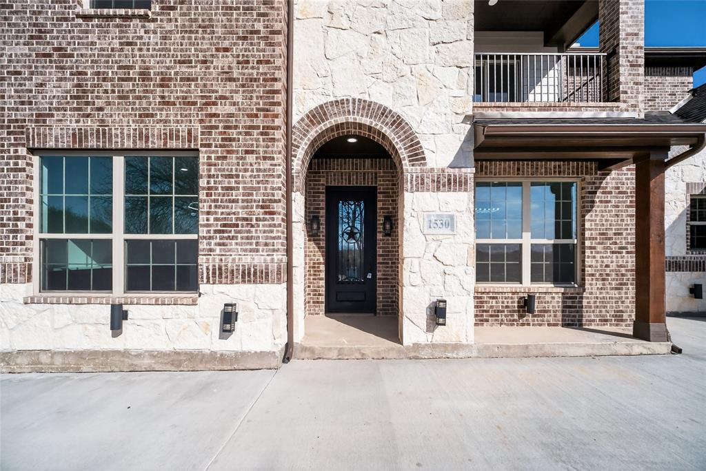 1530 South Houston School Road Lancaster, TX 75146 - Photo 4 of 37 a front view of a house with a yard and garage