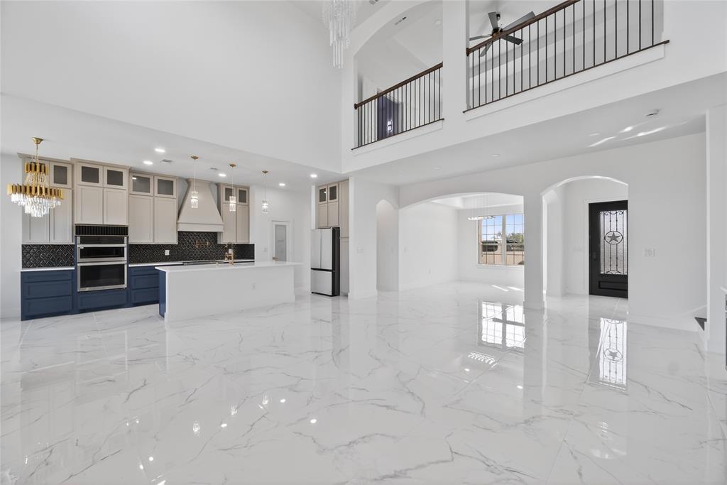 1530 South Houston School Road Lancaster, TX 75146 - Photo 7 of 37 a view of a kitchen with kitchen island and stainless steel appliances