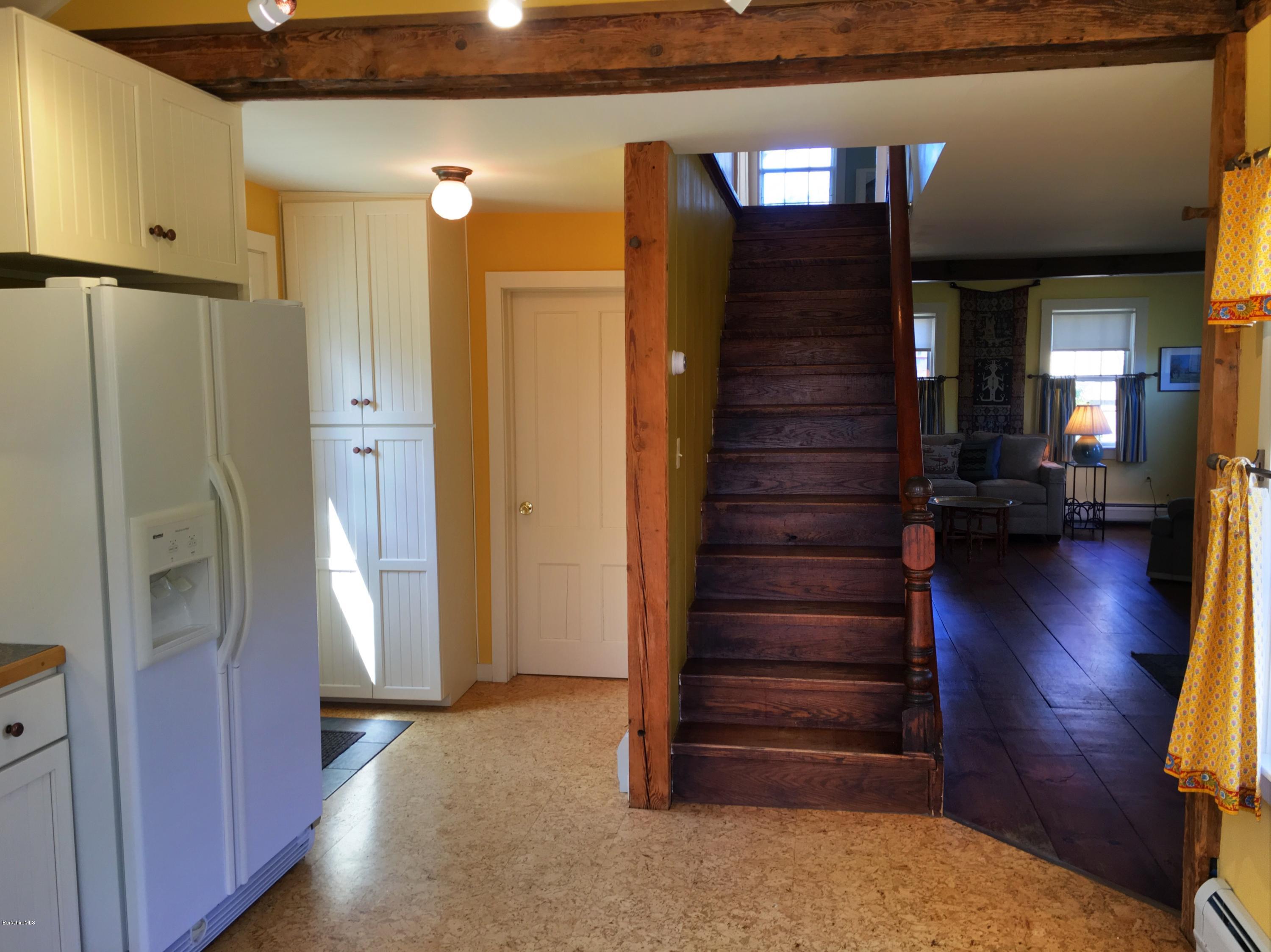 49 Sandisfield Road Sandisfield, MA 01255 - Photo 14 of 23 a view of a hallway with wooden floor and staircase