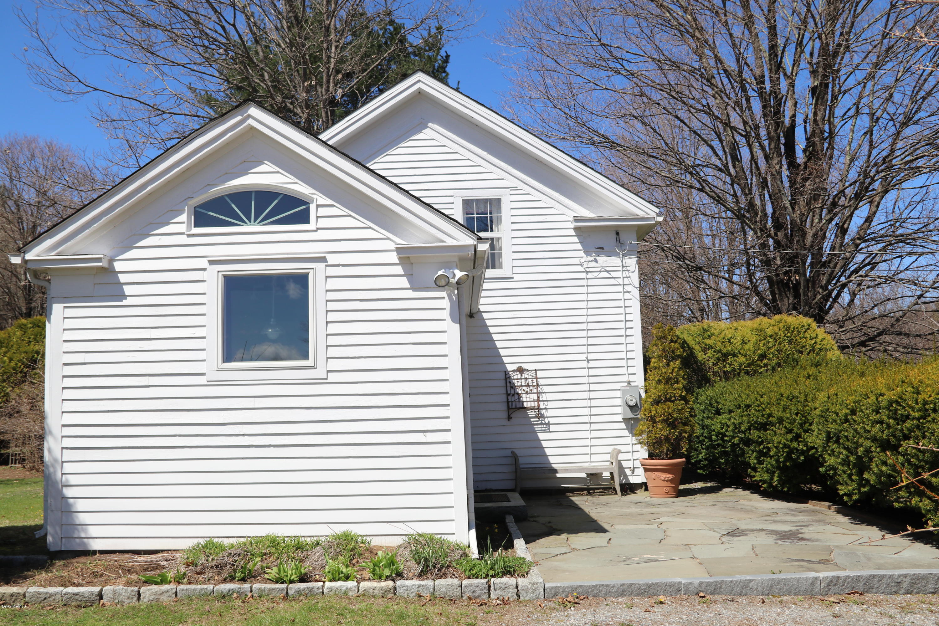 49 Sandisfield Road Sandisfield, MA 01255 - Photo 3 of 23 a view of a white house with a small yard and large tree