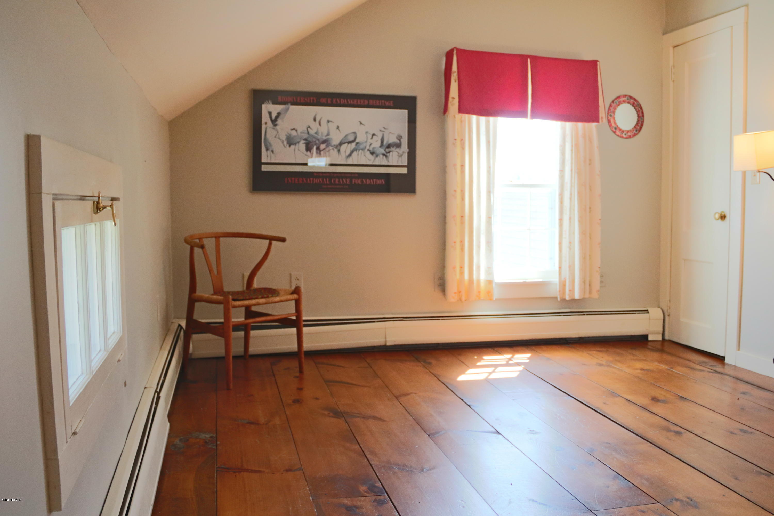49 Sandisfield Road Sandisfield, MA 01255 - Photo 22 of 23 a view of a room with wooden floor and a window