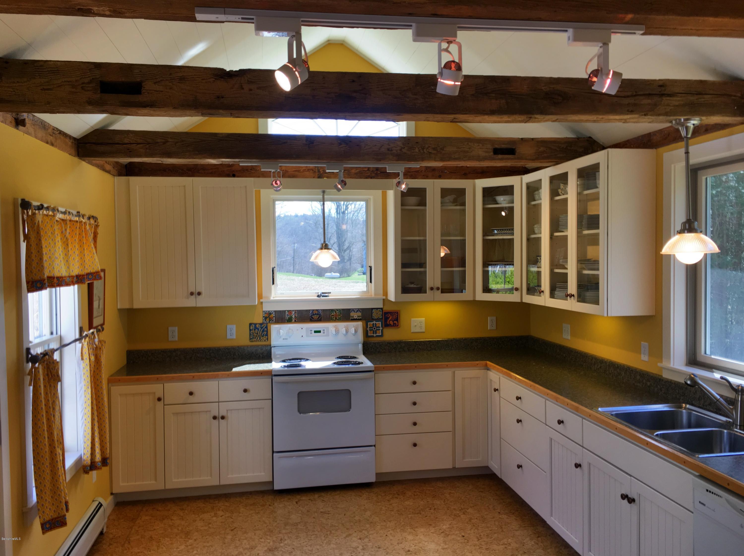 49 Sandisfield Road Sandisfield, MA 01255 - Photo 8 of 23 a kitchen with granite countertop a sink and cabinets