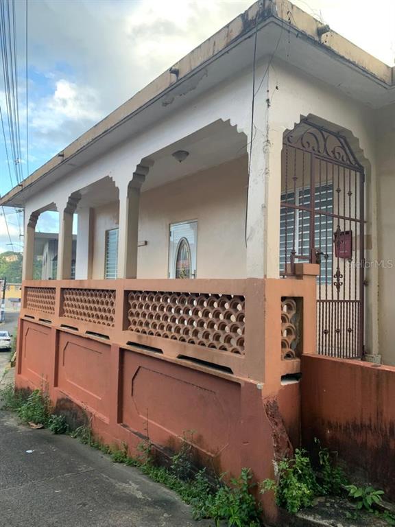 . Jose De Diego Street, Unit 87 Ciales, PR 00638 - Photo 1 of 1 a front view of a house with a yard