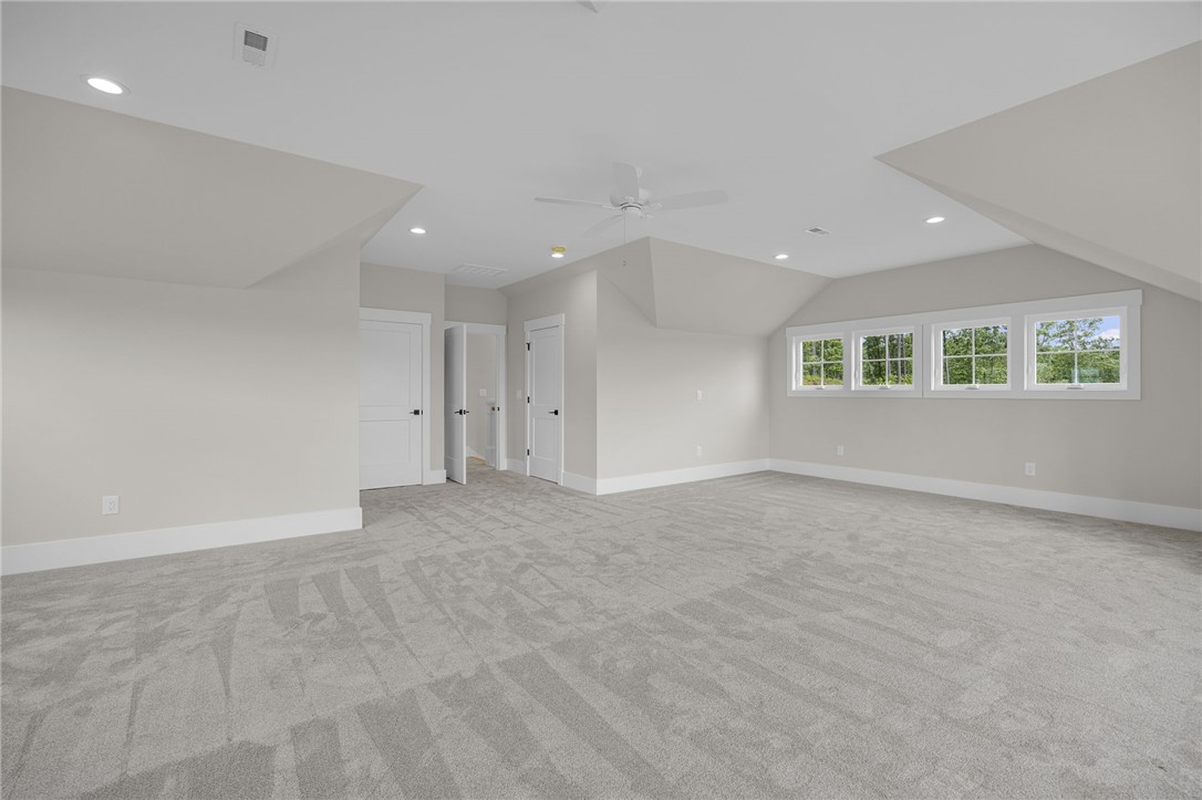 1230 Melton Road, Unit 216 West Union, SC 29696 - Photo 28 of 49 A spacious bedroom provides a blank canvas, offering ample natural light and modern recessed lighting.