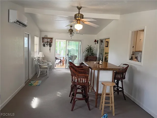 a dining room with furniture and window