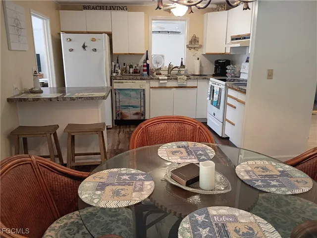 a kitchen with stainless steel appliances granite countertop a sink and a stove