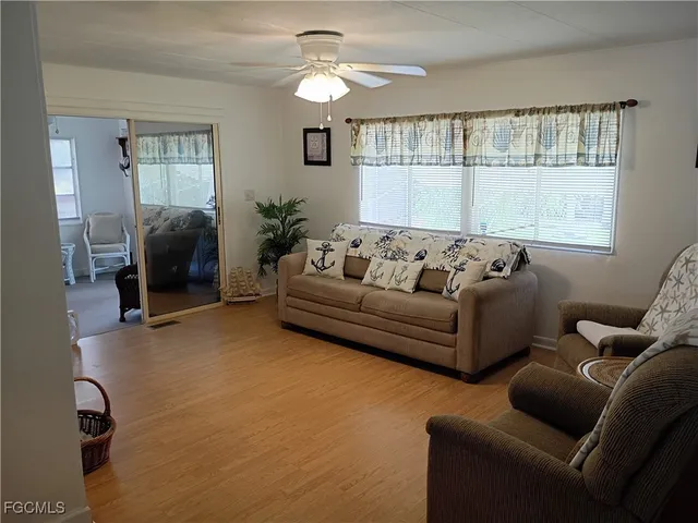 a living room with furniture and a window