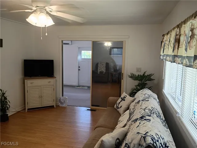 a living room with furniture and a flat screen tv
