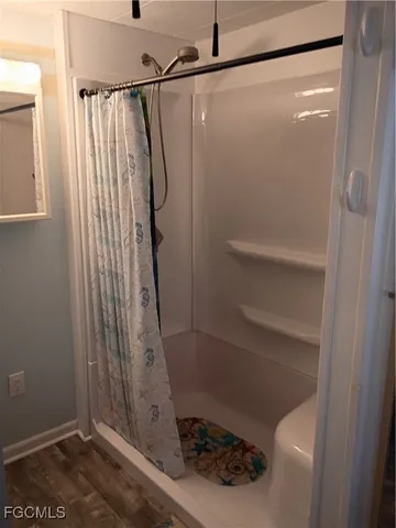a bathroom with a sink and a shower
