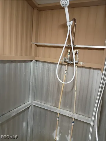 a potted plant sitting on the side of a brick house