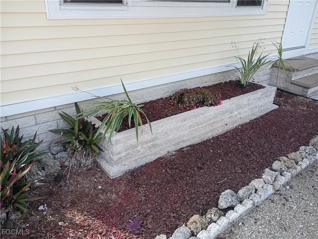 a view of a chairs and table on the patio