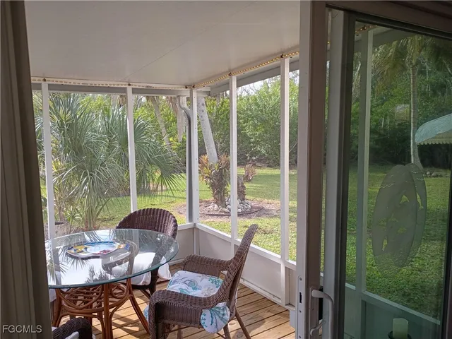 a view of a city from a dining room with large windows and outside view