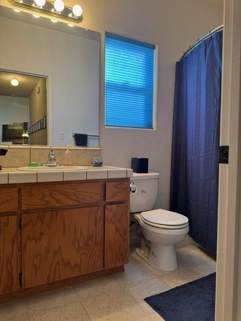 30639 Kit Fox Court Visalia, CA 93291 - Photo 13 of 16 a bathroom with a toilet sink and mirror