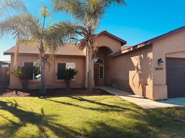 30639 Kit Fox Court Visalia, CA 93291 - Photo 2 of 16 a view of a house with a swimming pool and a patio