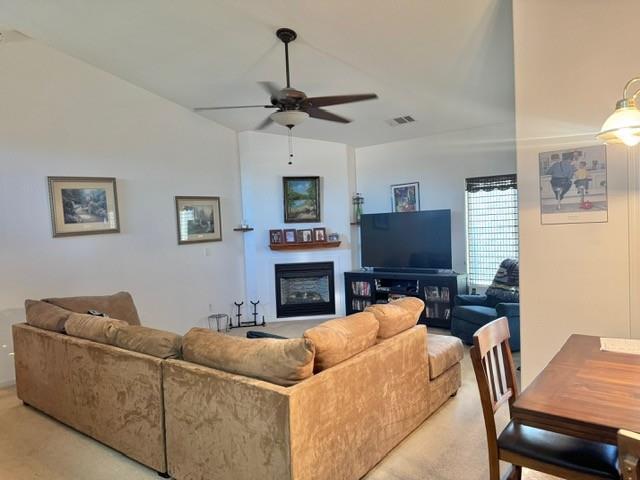 30639 Kit Fox Court Visalia, CA 93291 - Photo 4 of 16 a living room with furniture a fireplace and a flat screen tv