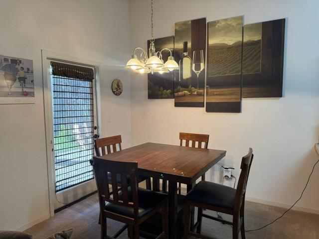 30639 Kit Fox Court Visalia, CA 93291 - Photo 5 of 16 a view of a dining room that has a table and chairs