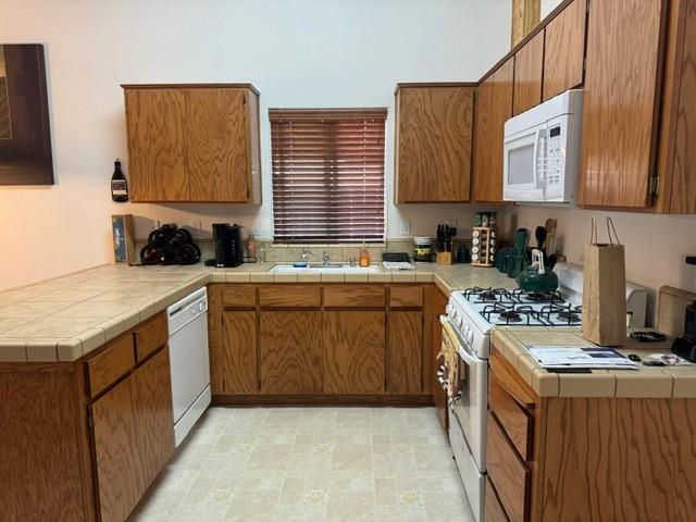 30639 Kit Fox Court Visalia, CA 93291 - Photo 7 of 16 a kitchen with a sink stove top oven and cabinets