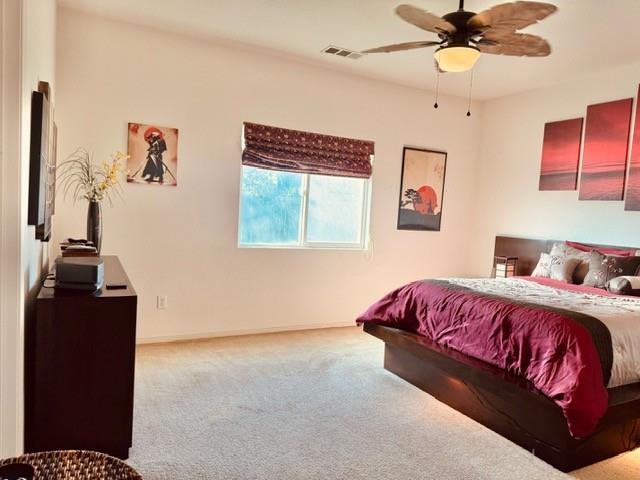 30639 Kit Fox Court Visalia, CA 93291 - Photo 9 of 16 a bedroom with a bed and wooden floor