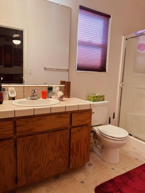 30639 Kit Fox Court Visalia, CA 93291 - Photo 10 of 16 a bathroom with a sink toilet and mirror