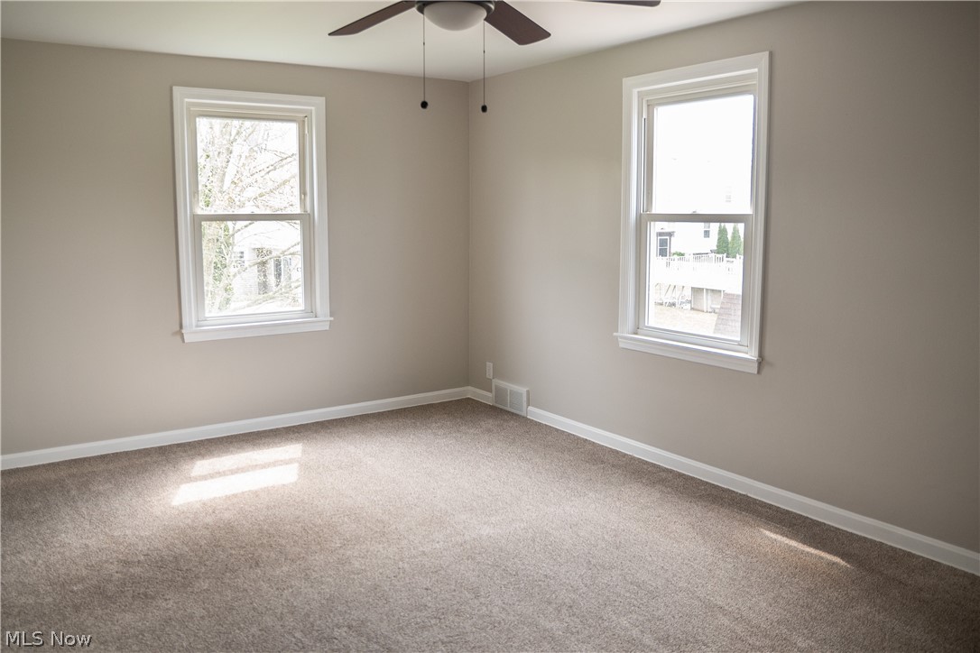 6666 Clingan Road Youngstown, OH 44514 - Photo 29 of 41 Largest bedroom with new carpeting, paint and ceiling fan