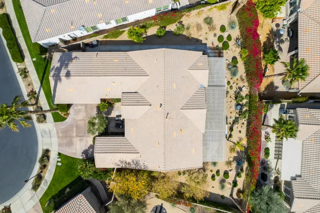 a living room with furniture a window and a flat screen tv