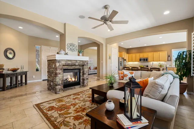 a front view of a house with a yard and outdoor seating