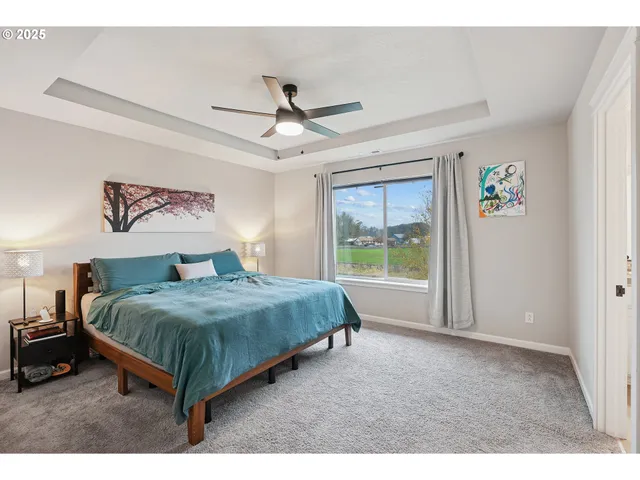 a bedroom with a large bed and a window